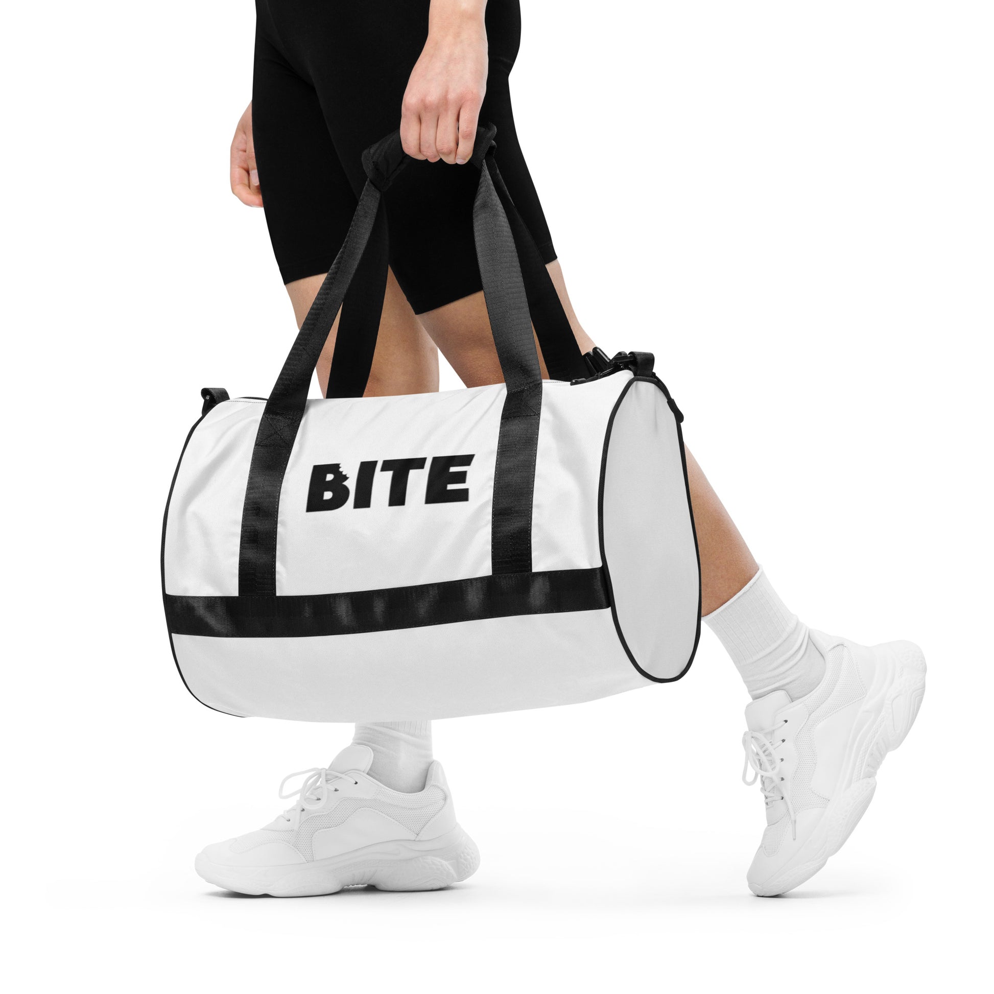 White gym bag with black straps and bold black lettering 